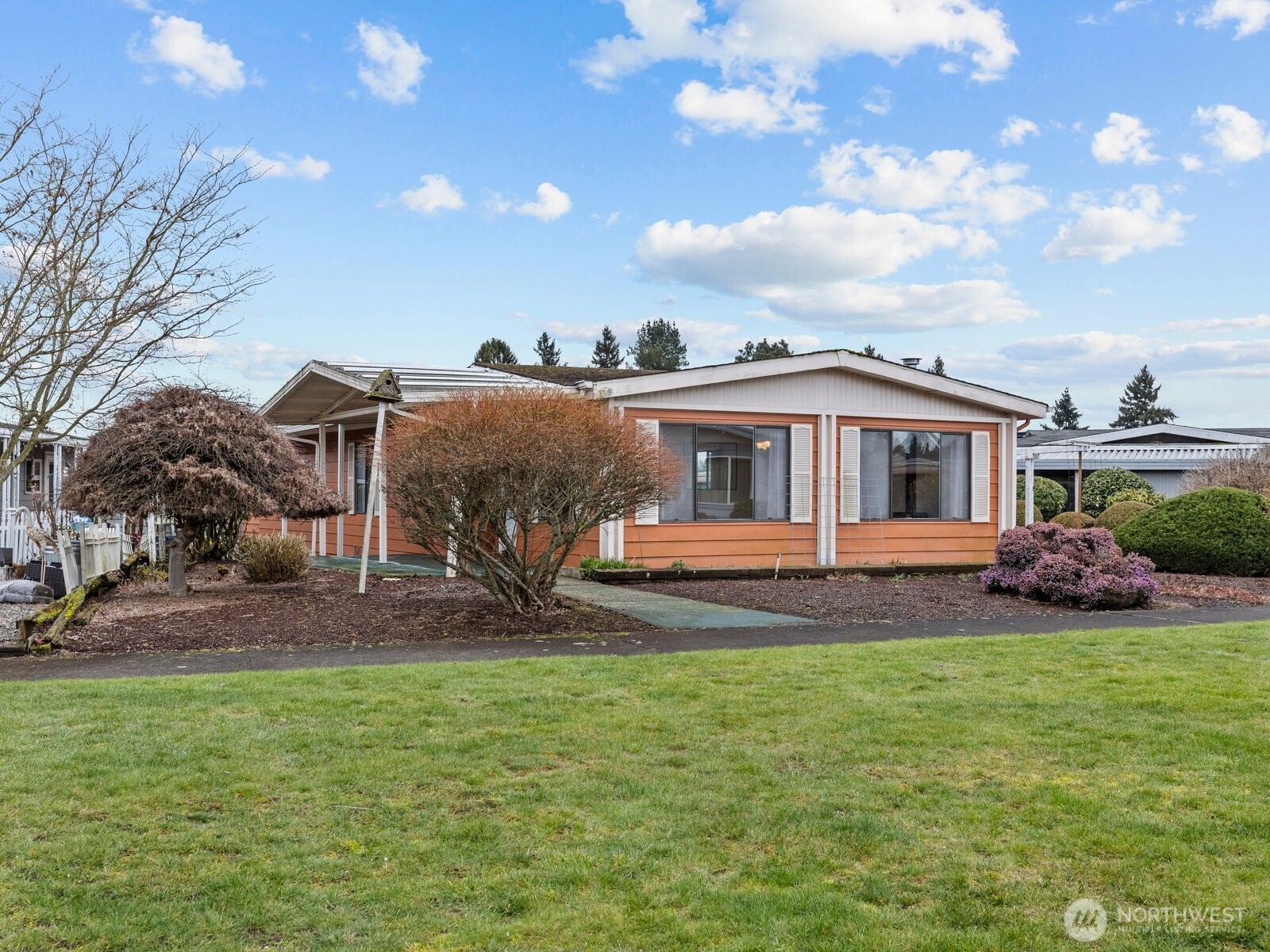At the front of the house you have green space rather than a road to keep things more quiet and private.