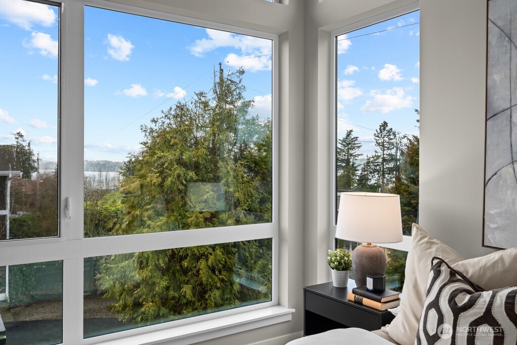Primary suite with views of Lake Washington and a lofty-feel.