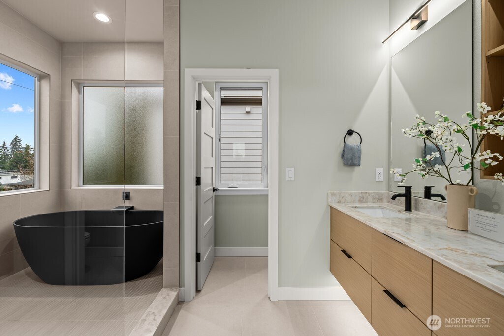 Primary suite showing layout of closet and primary bathroom. The stairs just outside lead the the giant roof-top deck.