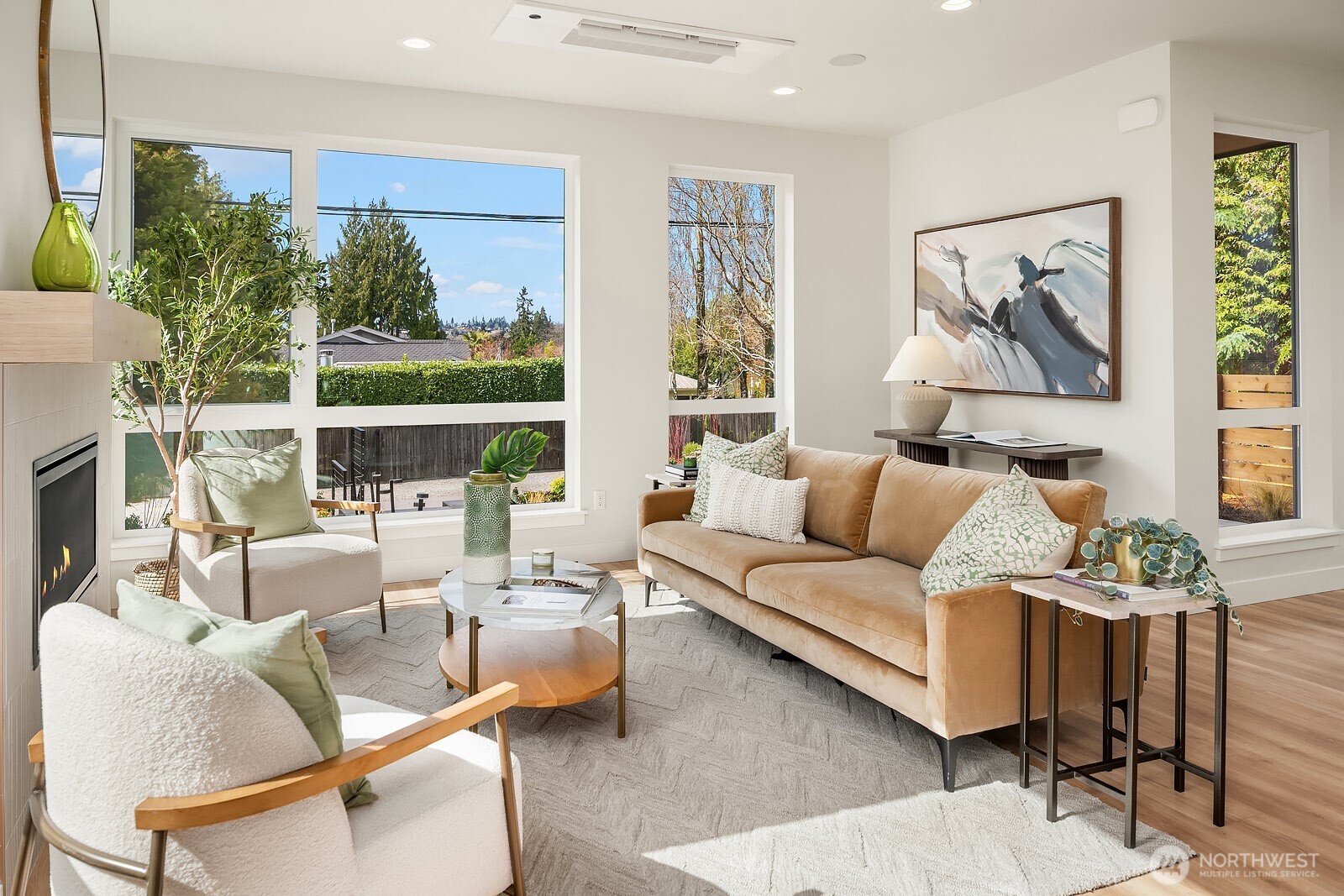 Floor to ceiling windows and sunny southwest exposure in the living room.