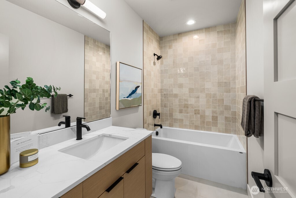 There are three bedrooms upstairs – here, the first of the two secondary bedrooms.