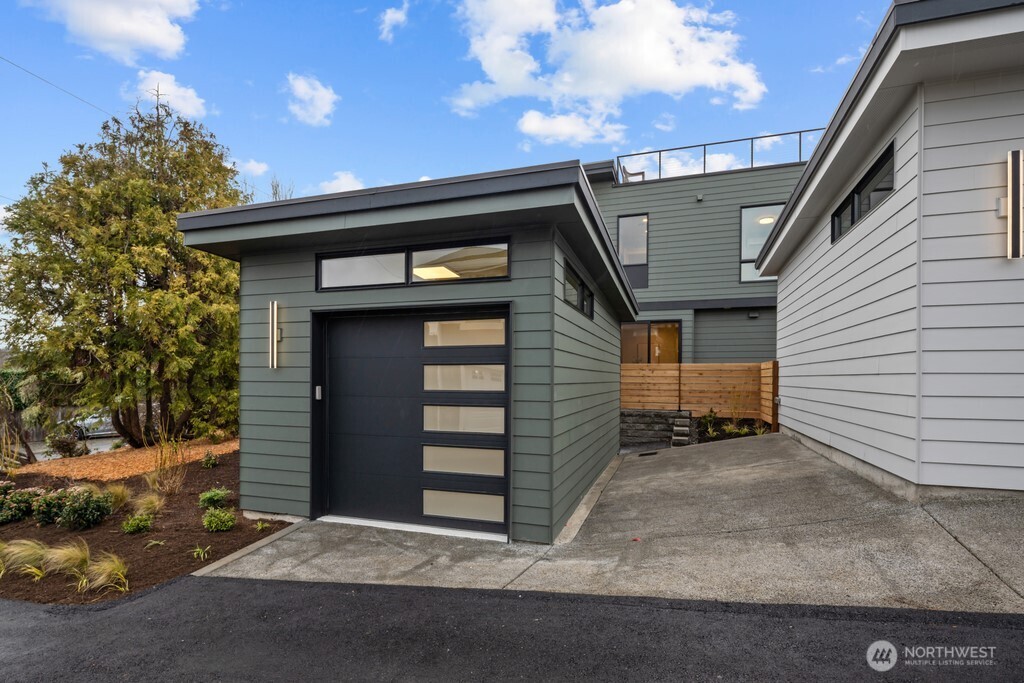 Wood-tone decking material and cable railing for ease of use and maintenance.