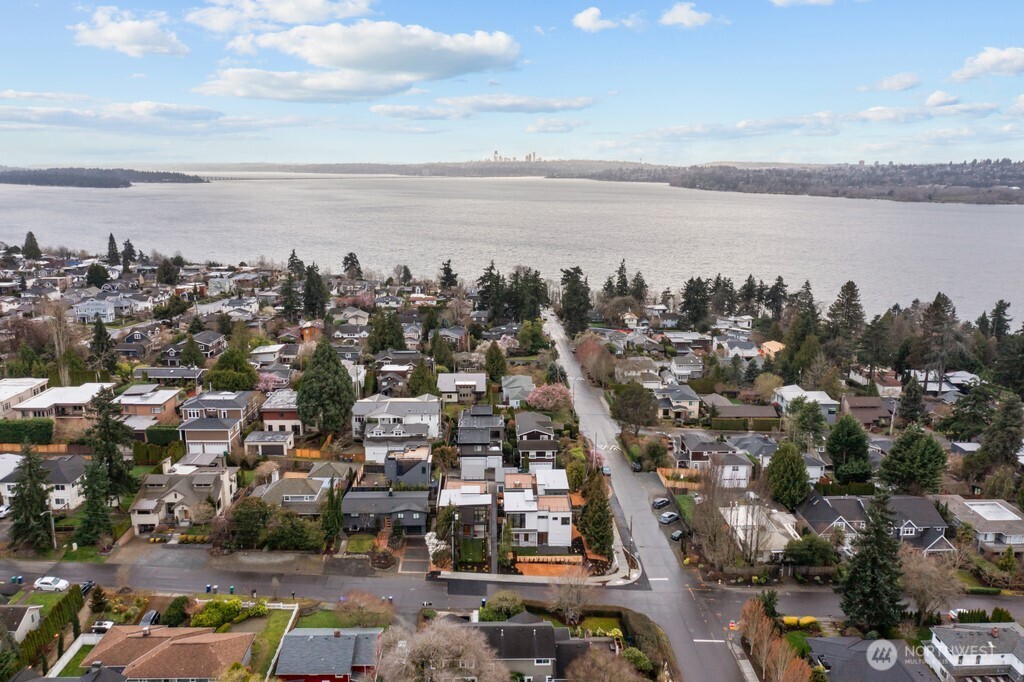 Detached garage with EV charging plus adjacent parking pad.
