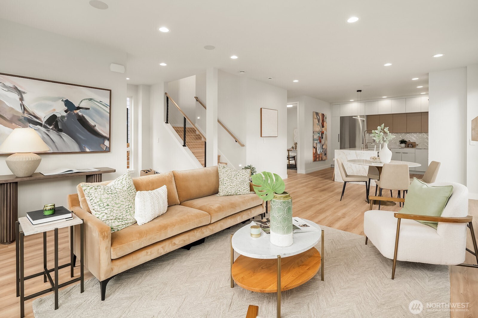 Great room layout with entry to the left (not shown) and den/office toward the back.