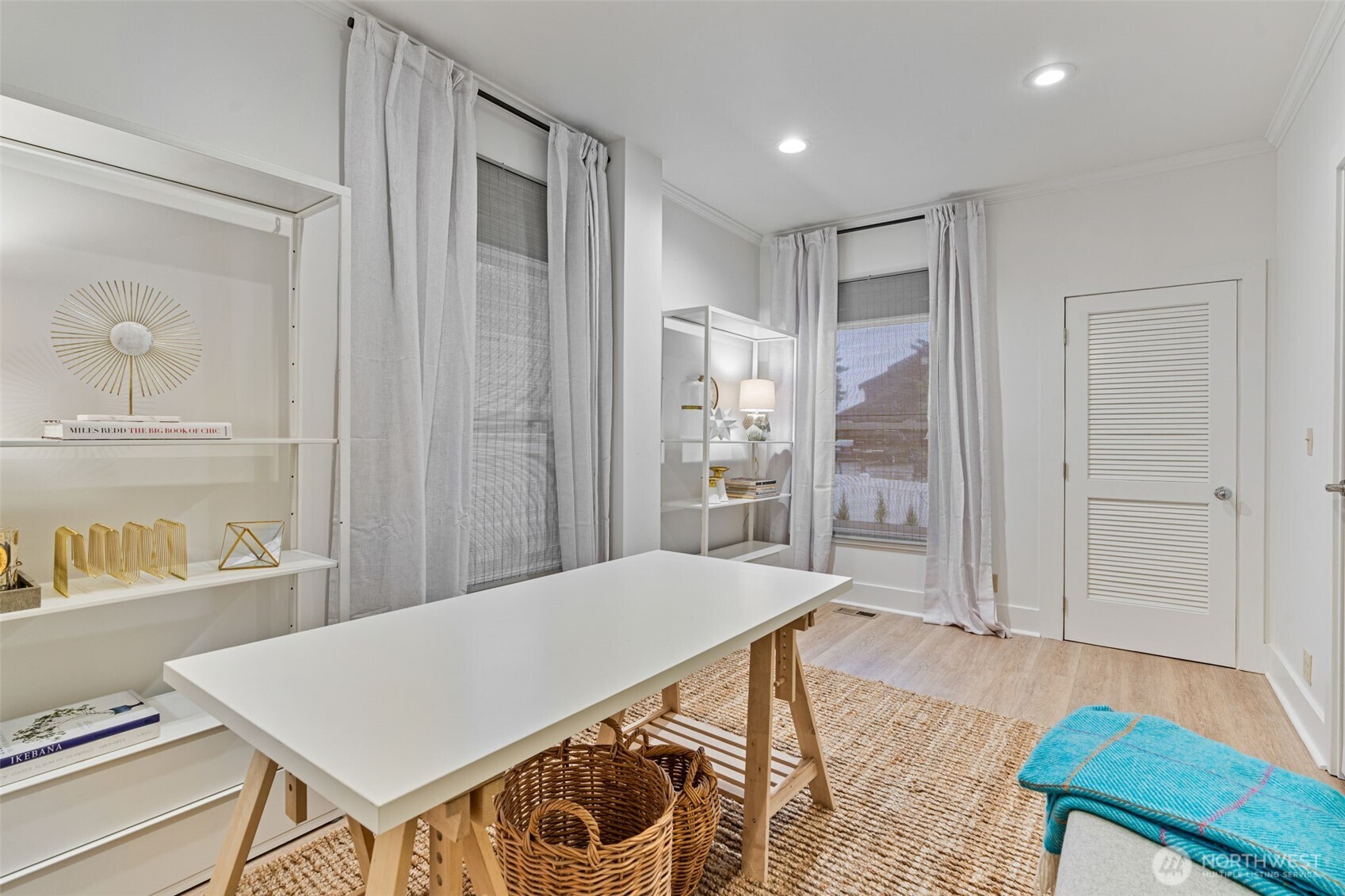 main floor office/bedroom with ample light from two large windows
