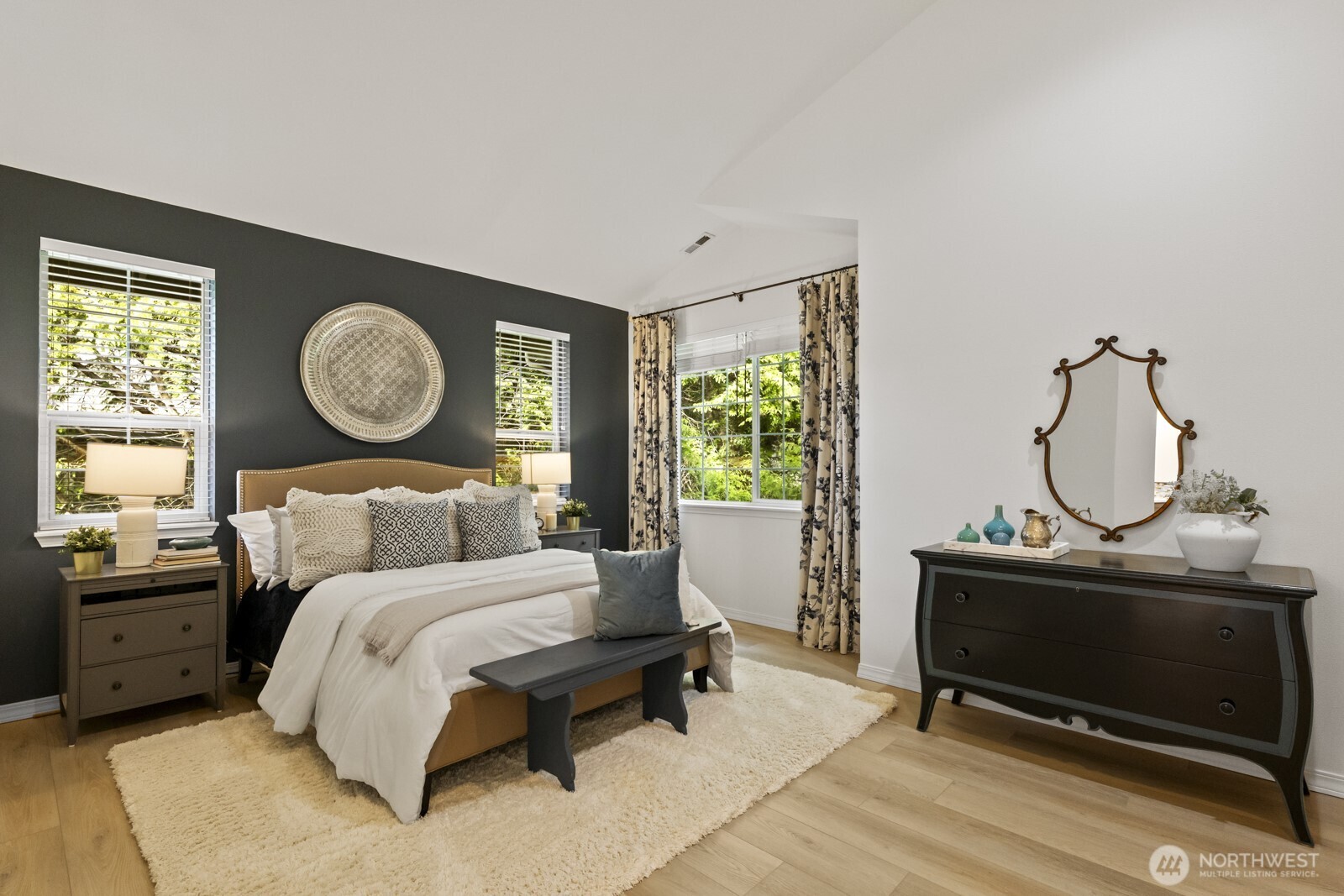 The primary bedroom is bright and spacious, yet comfortable and cozy.