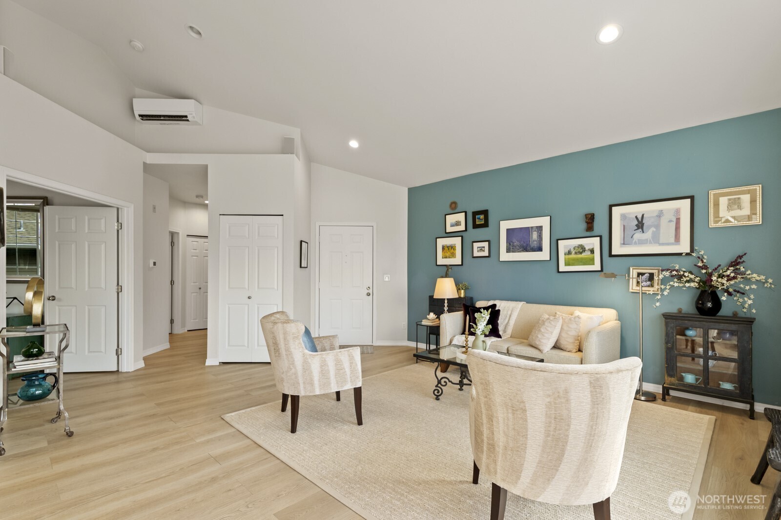 Luxury vinyl plank floors flow throughout, and sparkle in warm sunlight.