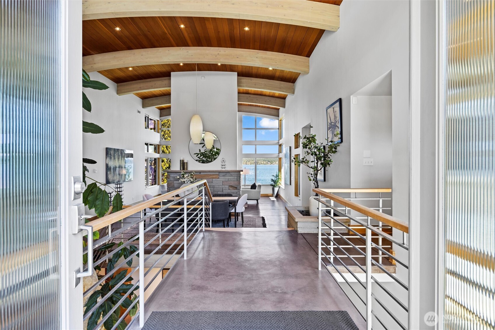 Architecturally significant 6,488 home with elegant atrium entry built around huge standing granite stone monolith, custom barrel ceilings.