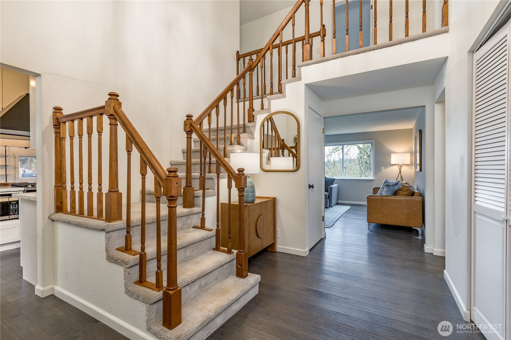 Bright 2-story entry with engineered hardwood flooring