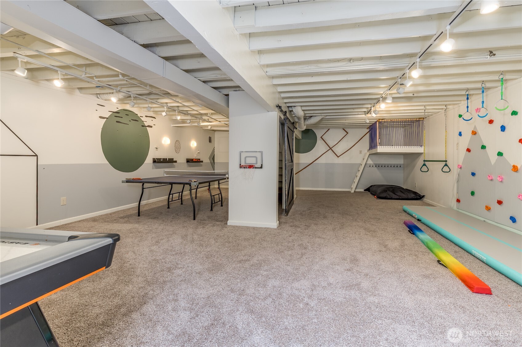 Massive lower-level rec room with space for gaming and lounging
