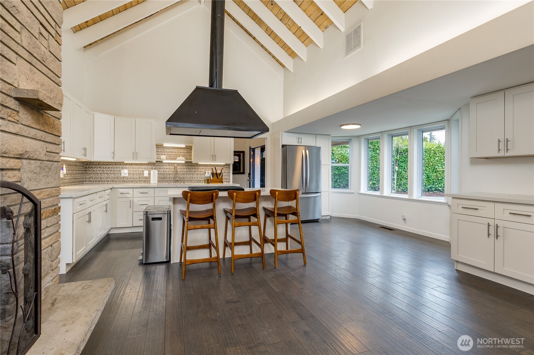 Expansive kitchen boasts cathedral ceilings