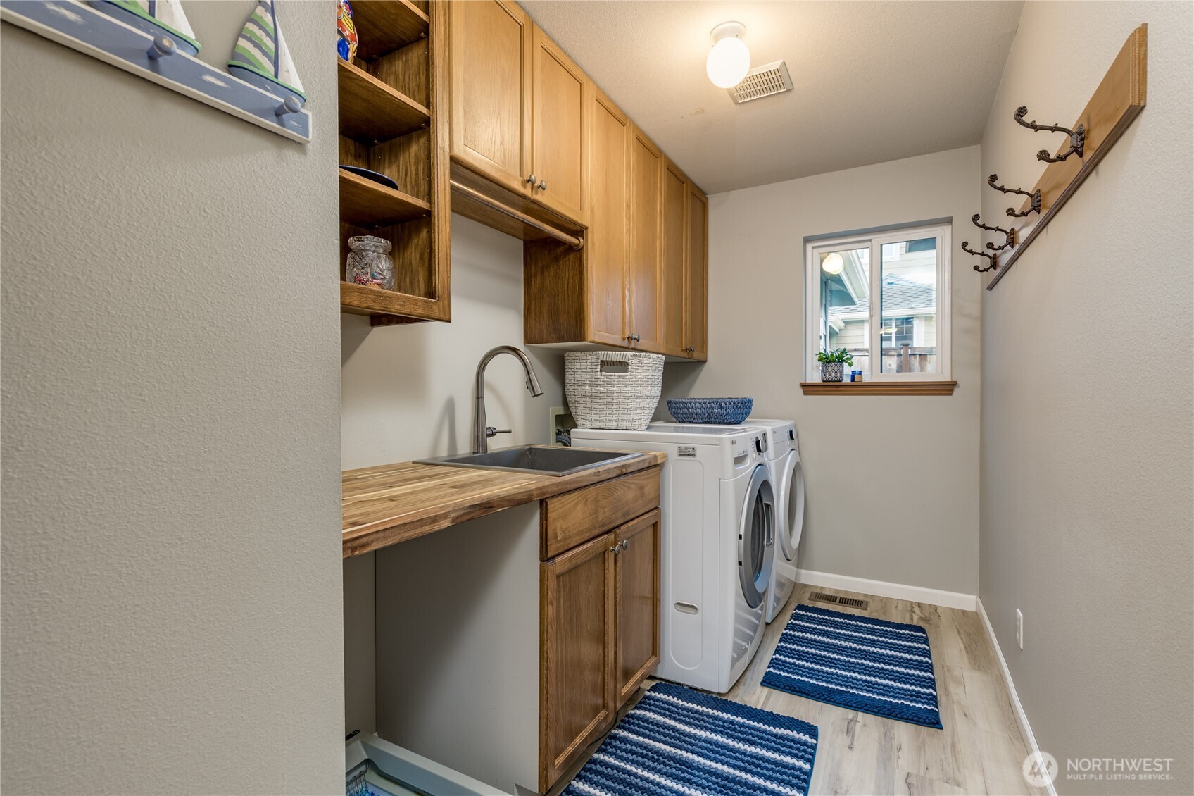 Large laundry room with utility sink