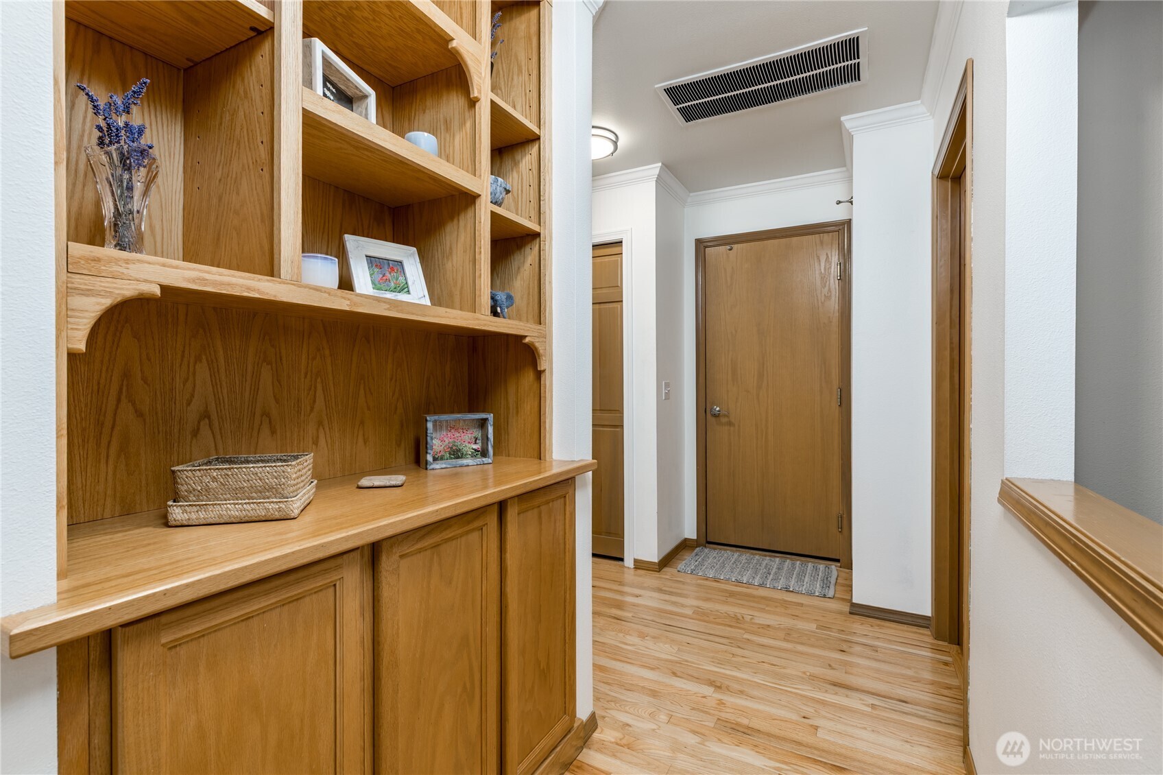 Built-in shelving & cabinets between the family room and kitchen