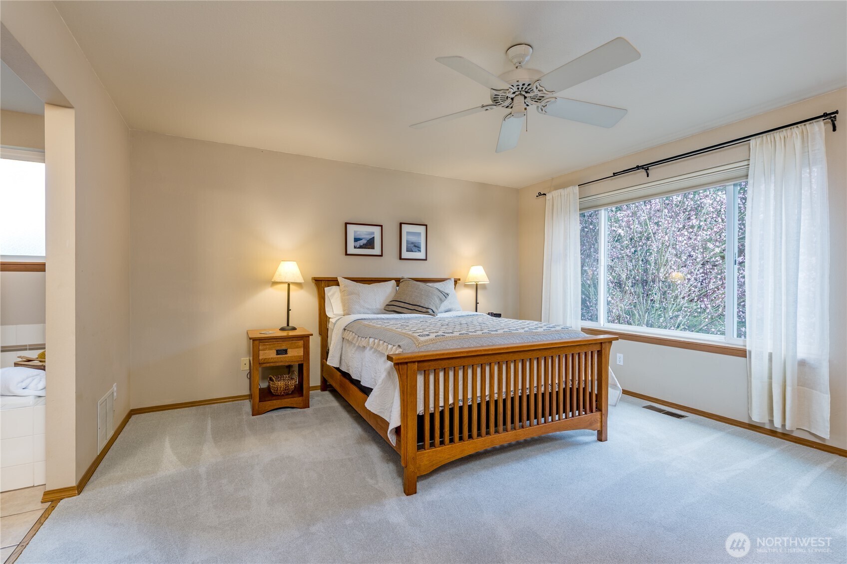 Spacious primary suite overlooks your beautiful back yard