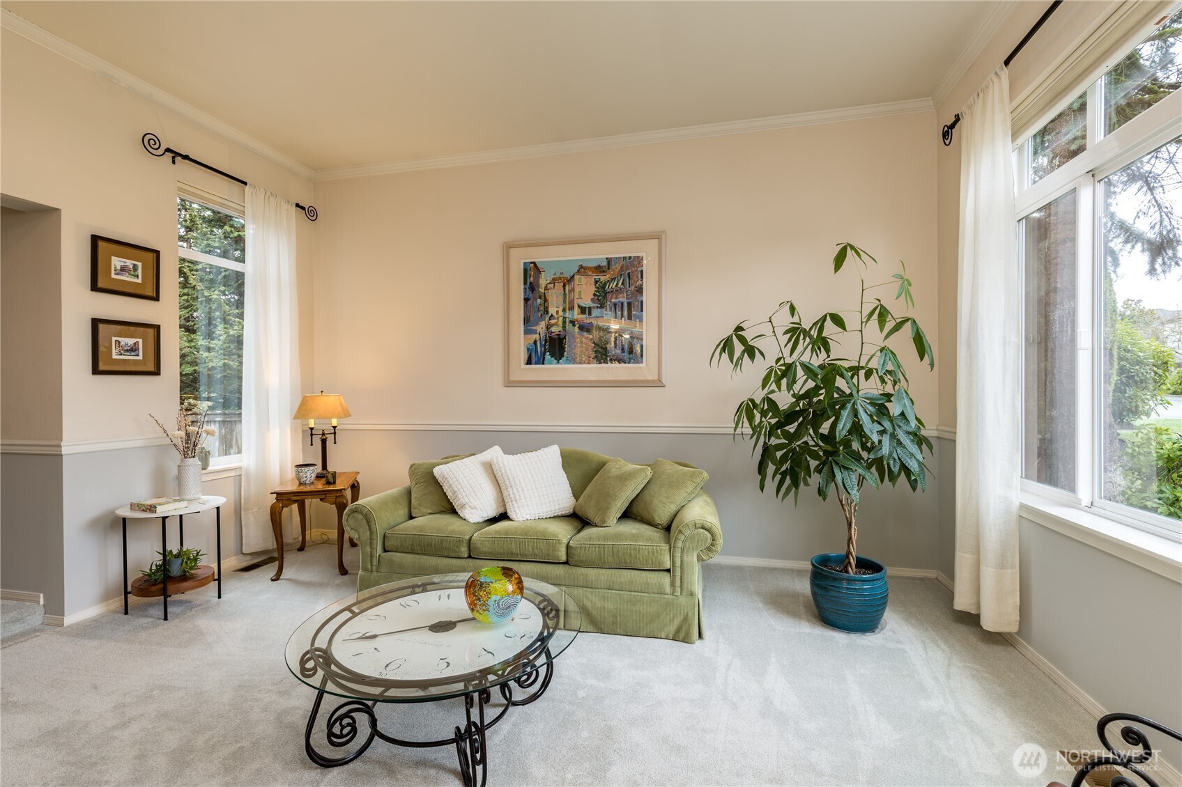 Bright living room with chair rail and crown moulding