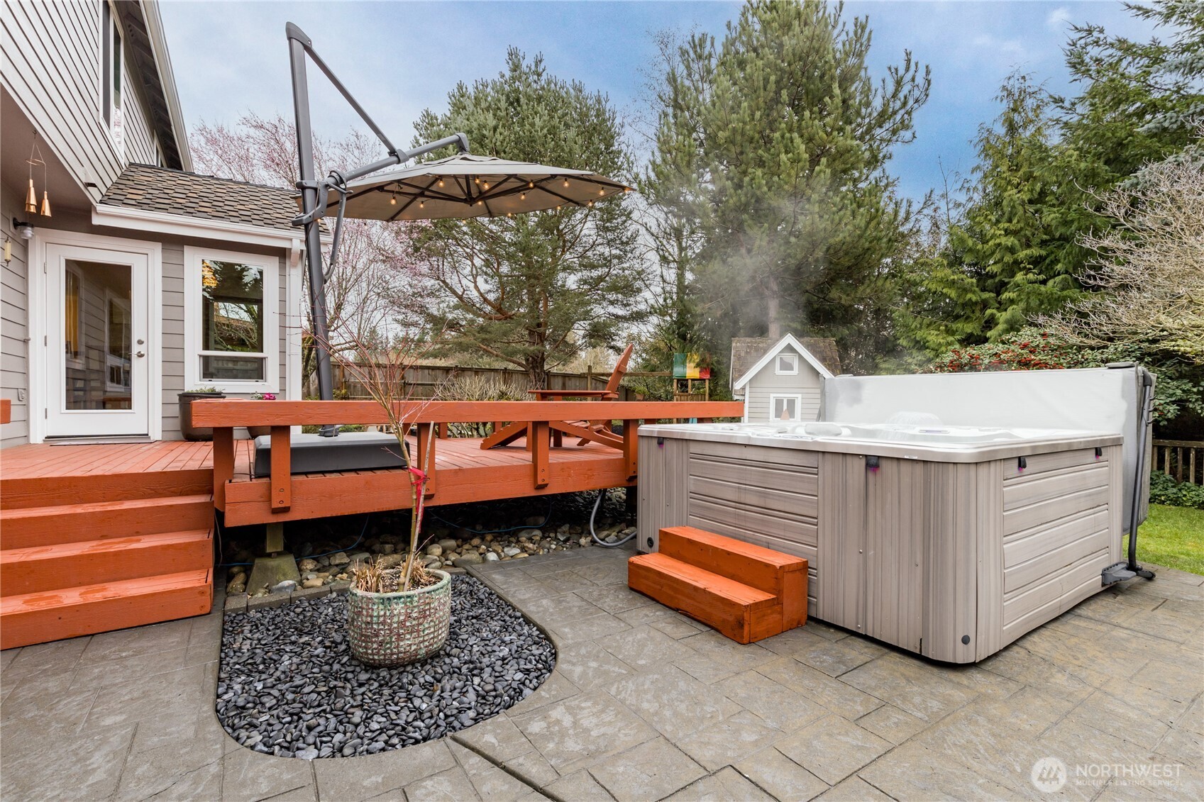 Second stamped concrete patio on this side of the deck