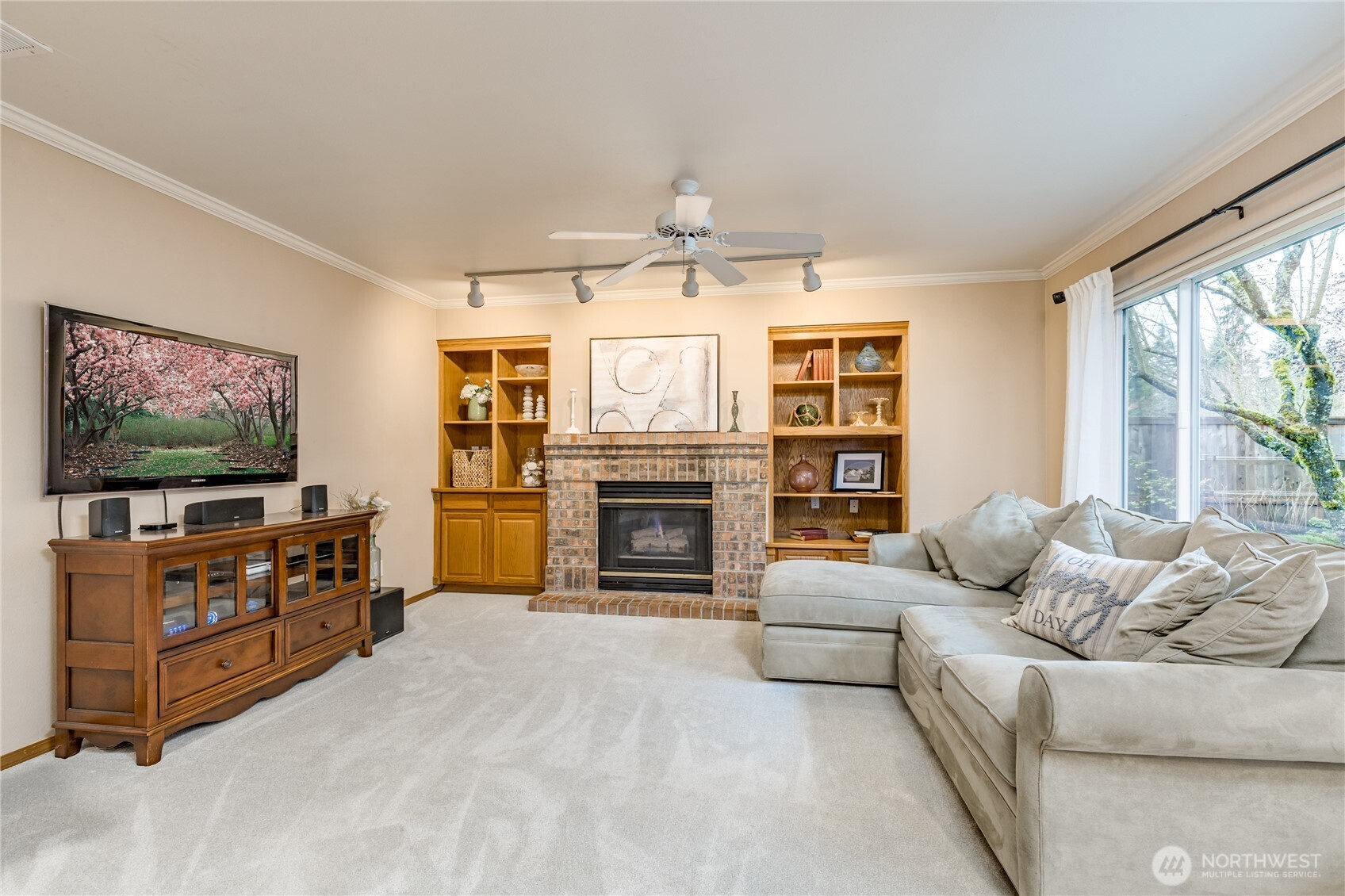 Cozy family room with gas fireplace, built-in shelving