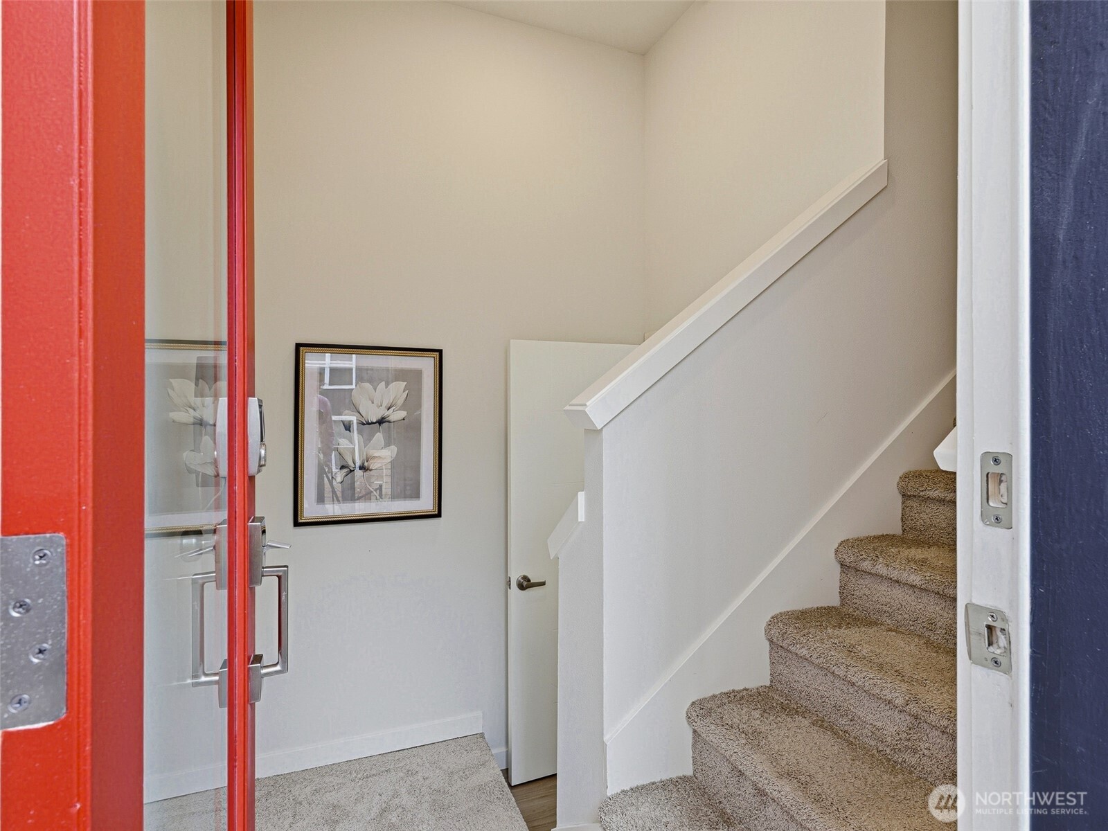 From the main entrance, take the stairs up to the open kitchen and living space, or enter straight ahead to the live/work space