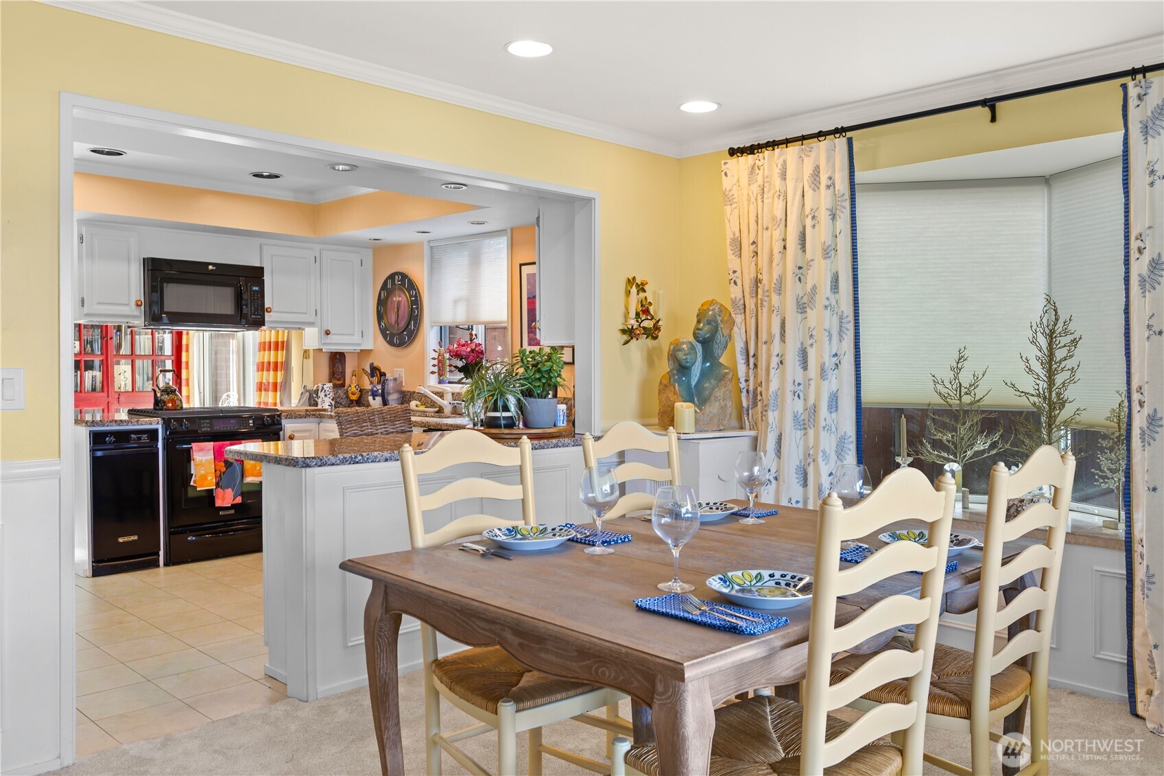 Formal dining room conveniently located adjacent to the kitchen.
