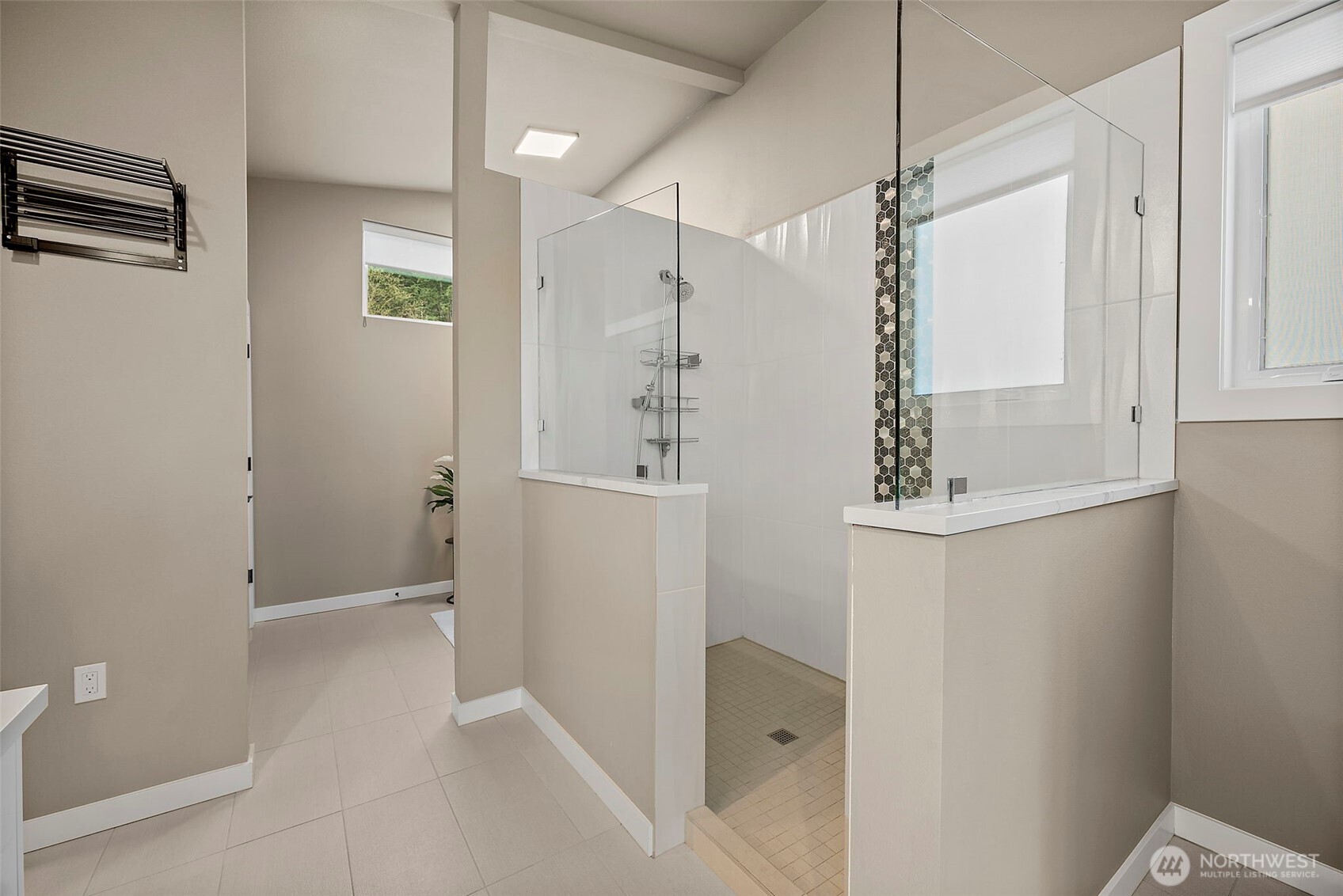 Primary bathroom walk in shower with glass enclosure