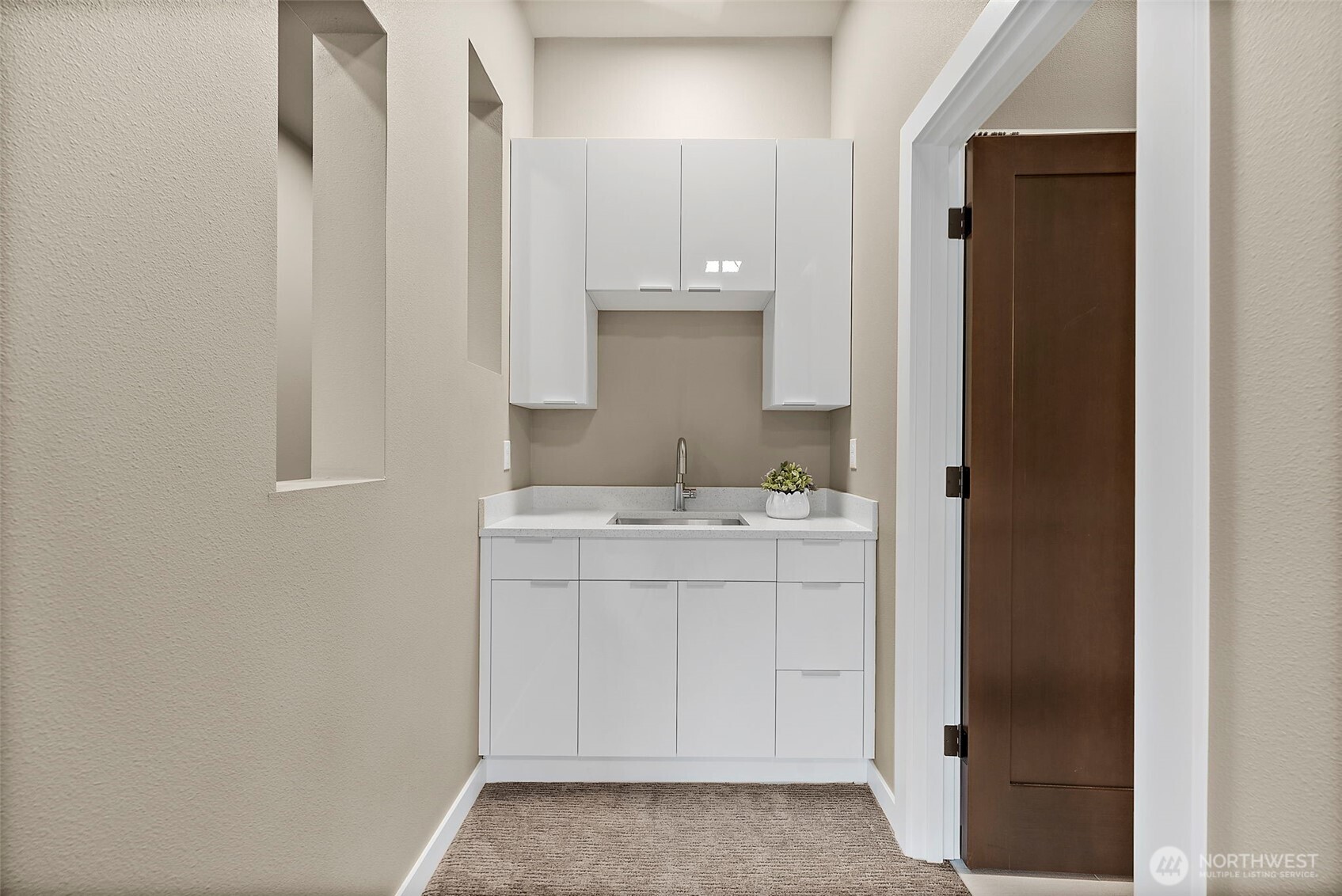 Down stairs wet bar for entertaining of the media room