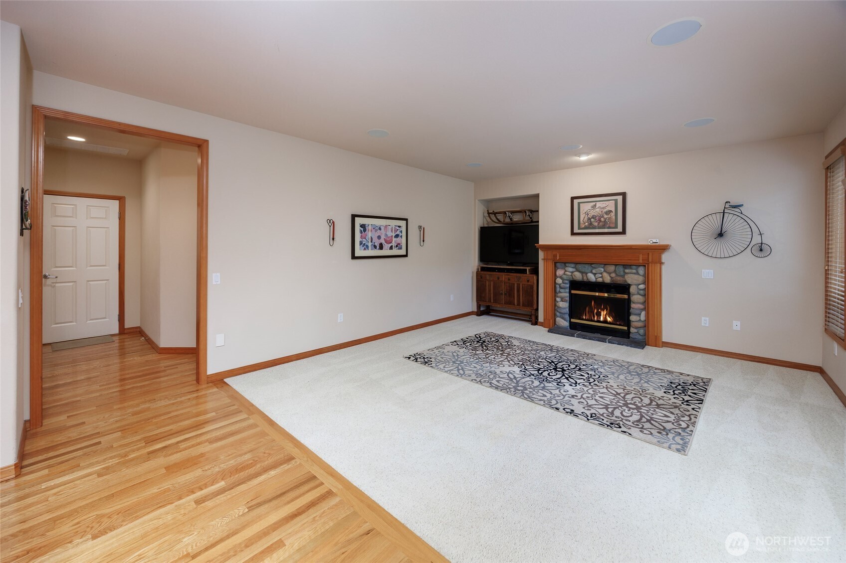 Family room w/gas rock fireplace & French doors to bacyard/patio.