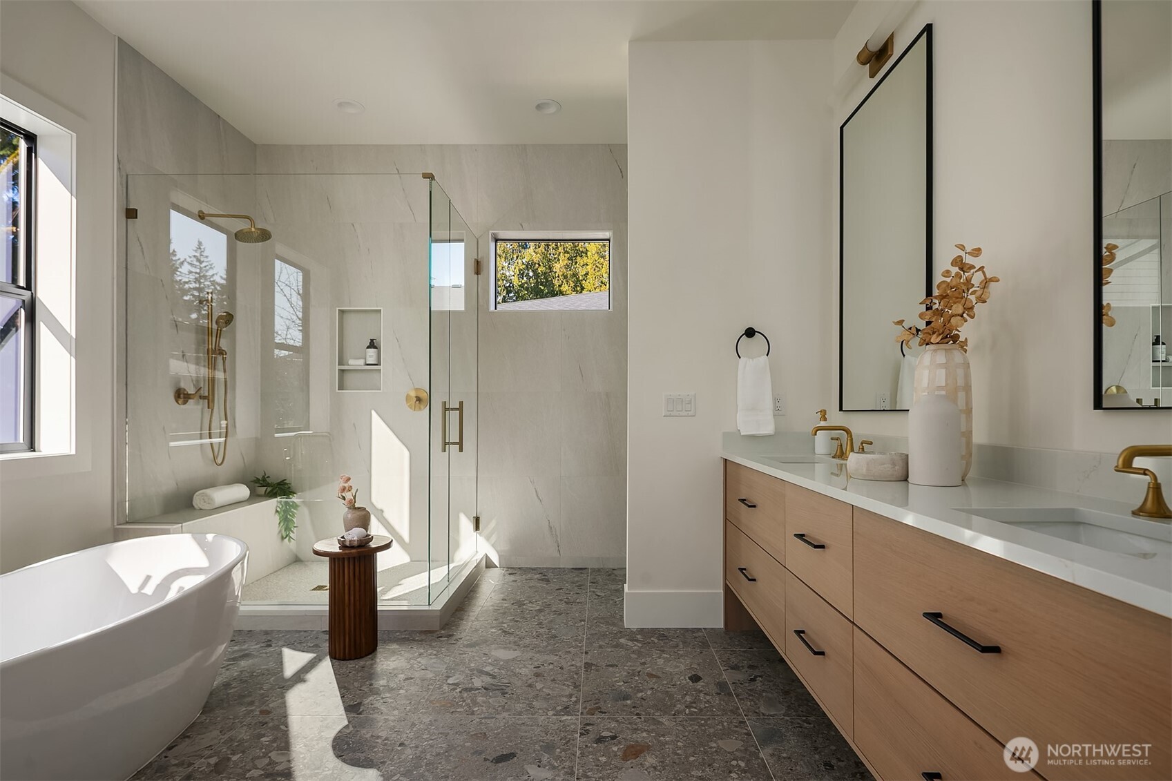 The spa-inspired primary bath features a sophisticated five-piece design with heated floors, delivering everyday luxury and relaxation.