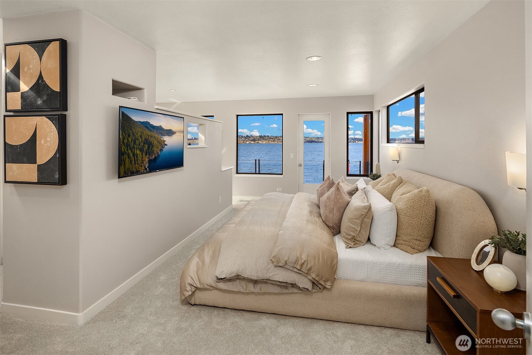Wake up and fall asleep with lake views from the primary!