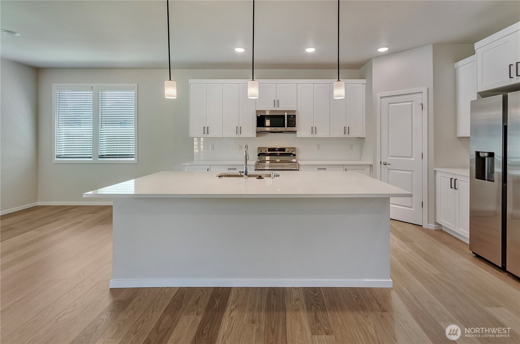 Photos are taken of a Shelby plan previously built in the community.