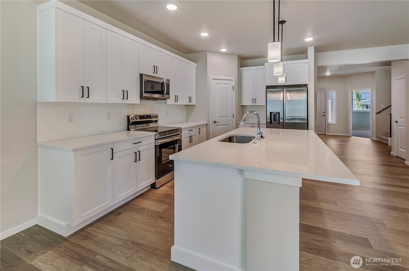 Photos are taken of a Shelby plan previously built in the community.