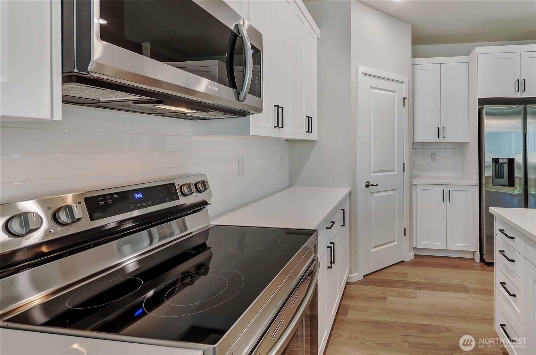 Photos are taken of a Shelby plan previously built in the community.