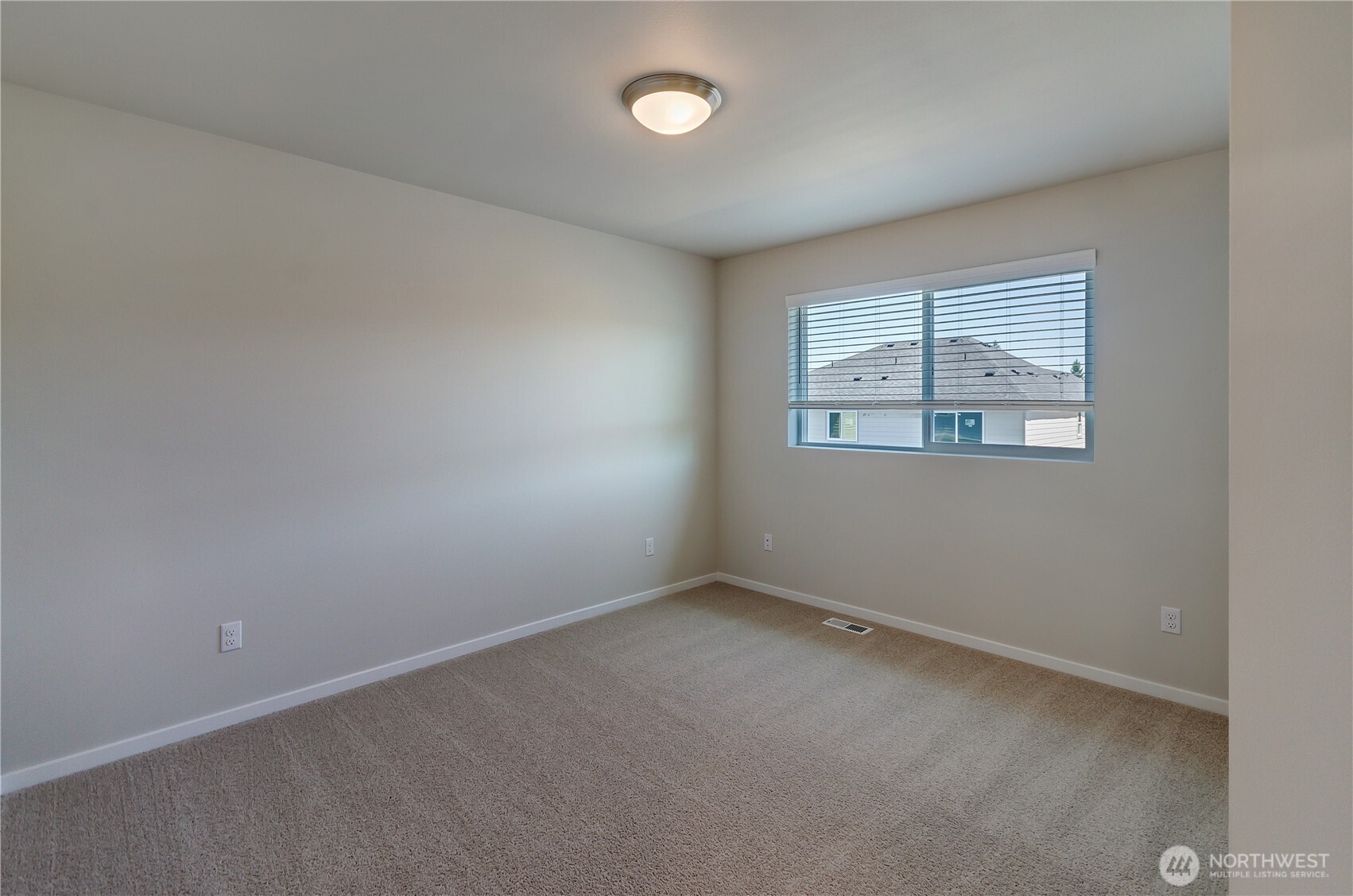 Photos are taken of a Shelby plan previously built in the community.