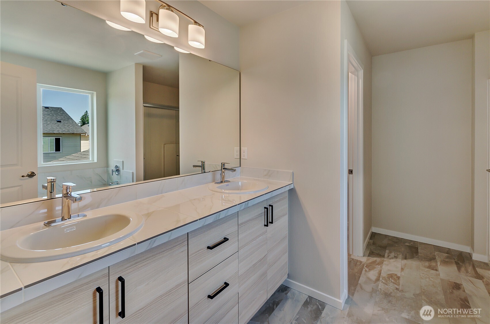 Photos are taken of a Shelby plan previously built in the community.