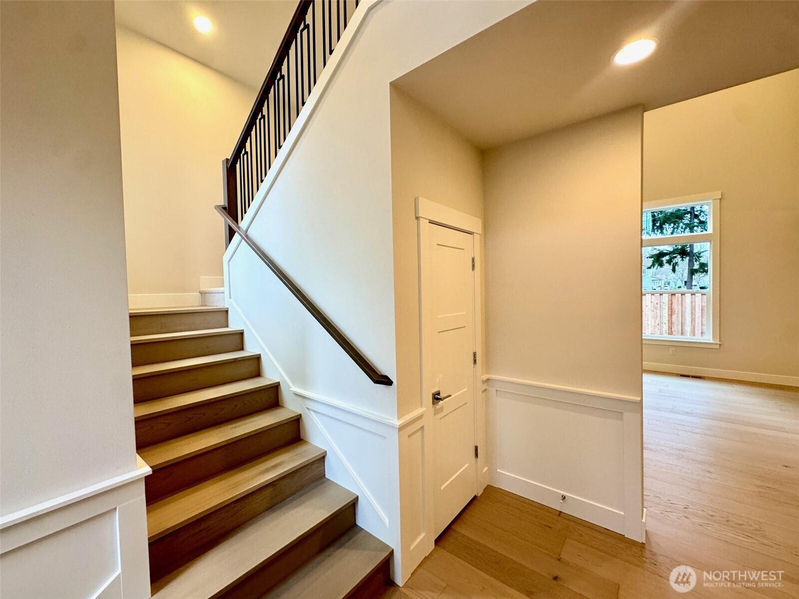 Main floor has extensive wood floor and wood stairs to Landing.