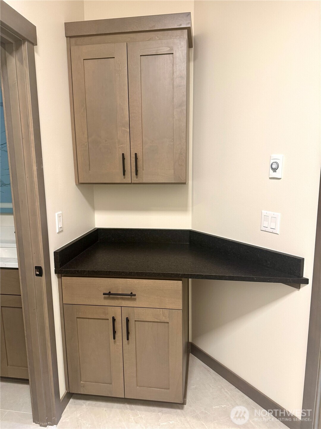 custom tile shower with built-in niche and Euro glass shower door.