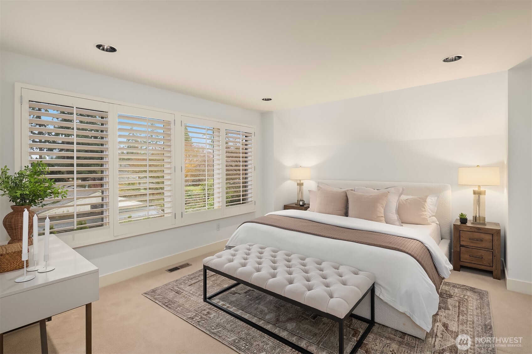 Upstairs, the spacious primary suite offers a peaceful retreat with a walk-in closet and ensuite bath with dual vanities.