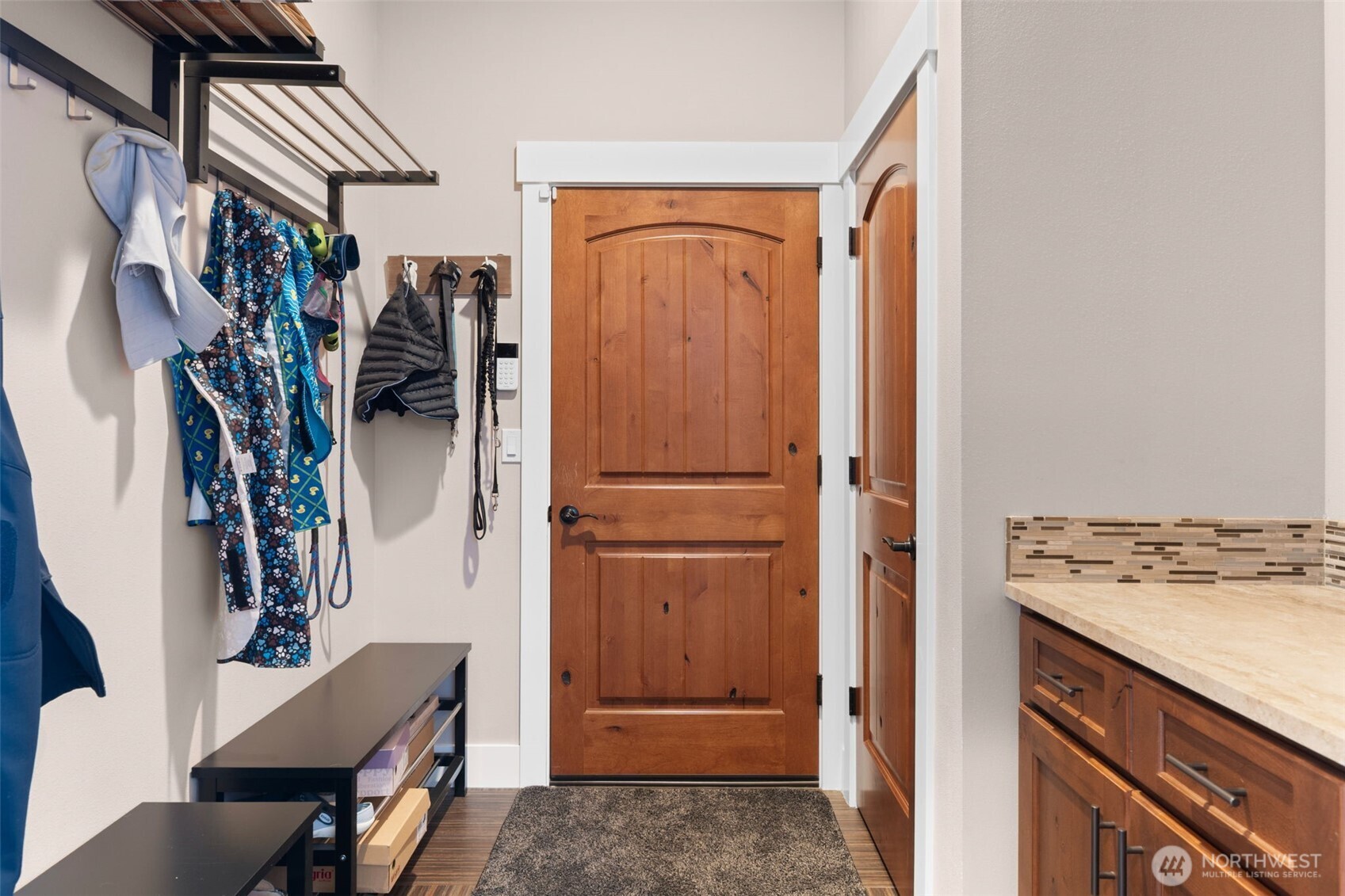 Functional mudroom or entry area with built-in bench seating and storage.