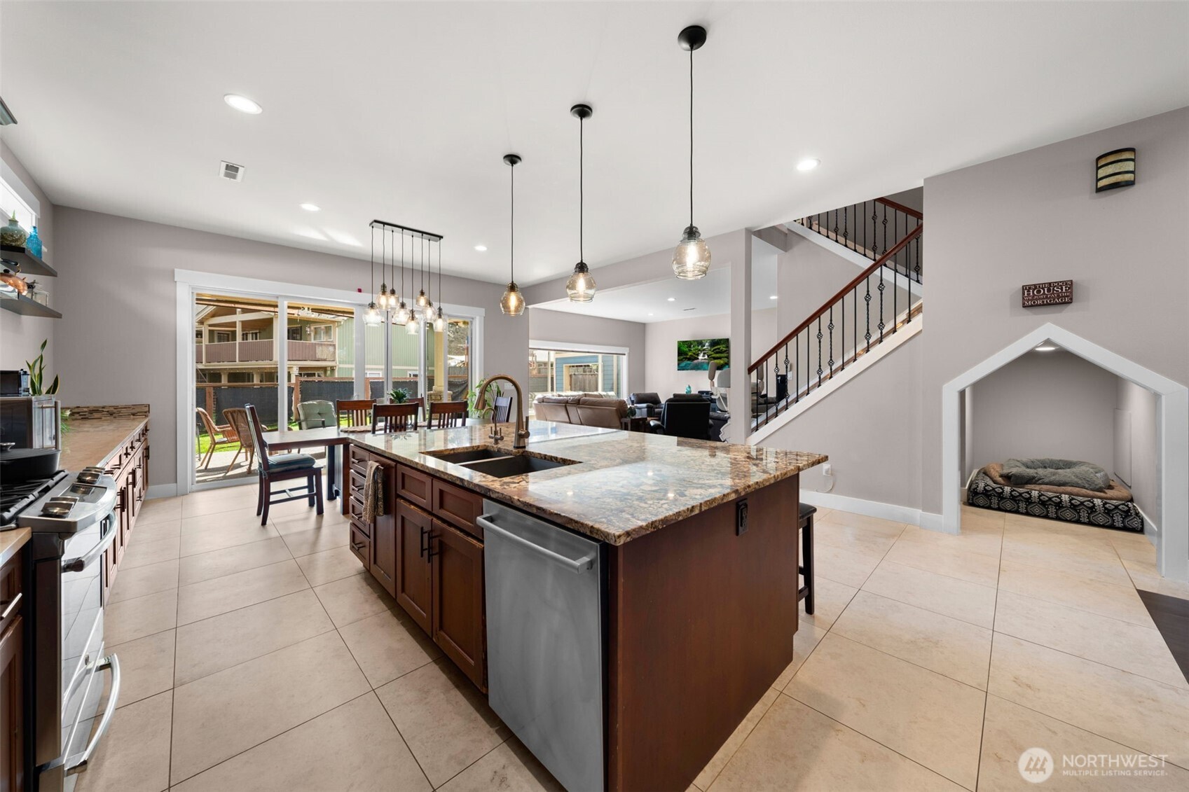 Beautiful Stainless appliances, and a nook for furry friends under the stairs.