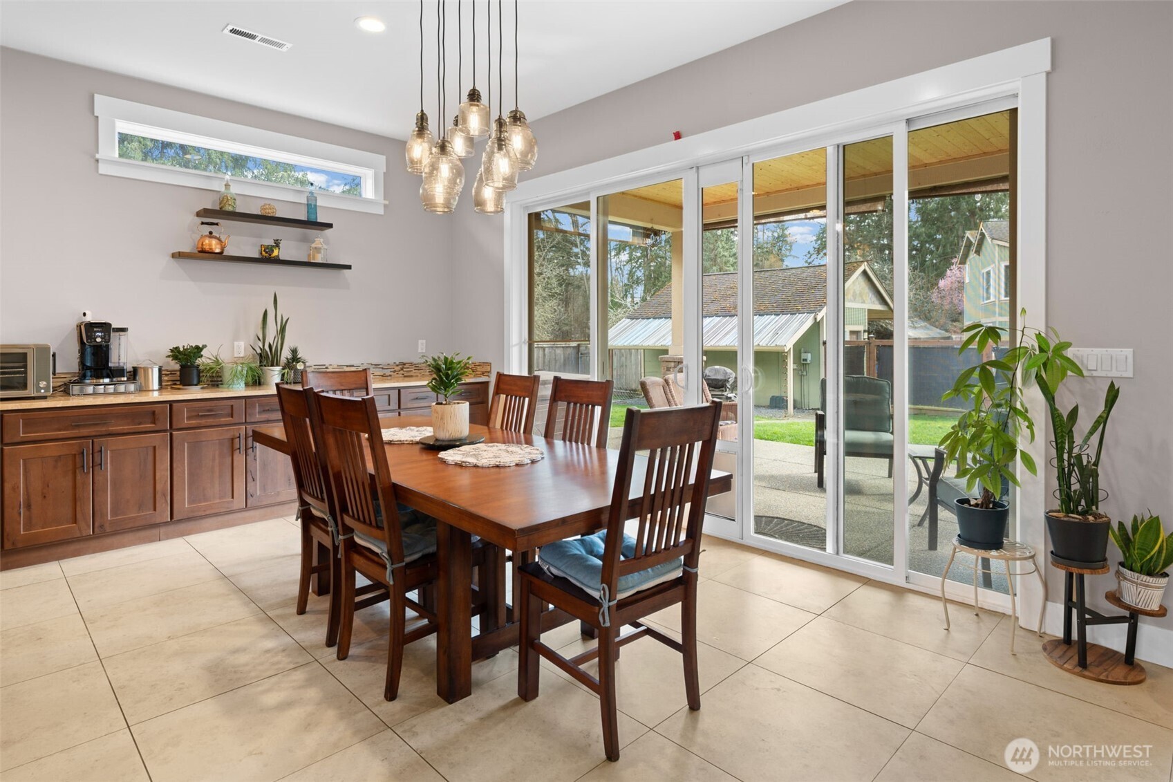 Dining area opens to the backyard and connects seamlessly to the main living spaces.