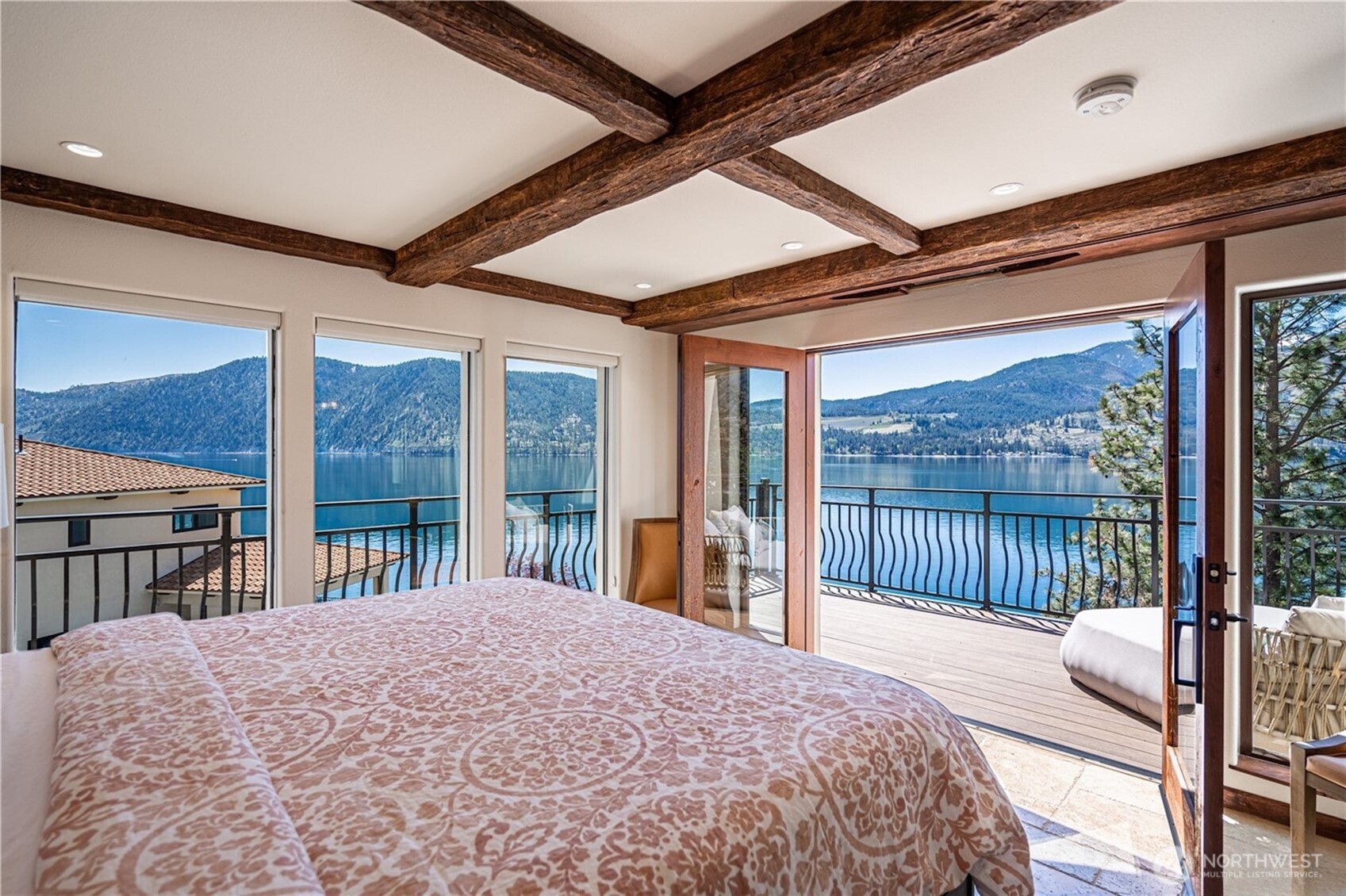 Spacious guest bedroom with private terrace access.