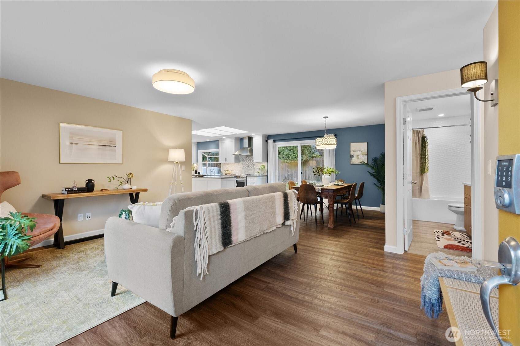 Bright and open living room flow to dining and kitchen.