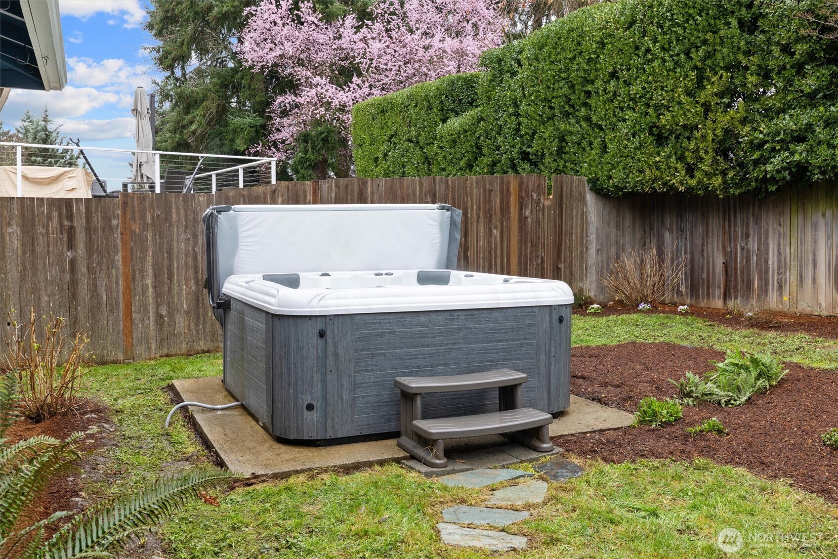 Concrete pad with hot tub hookup.
