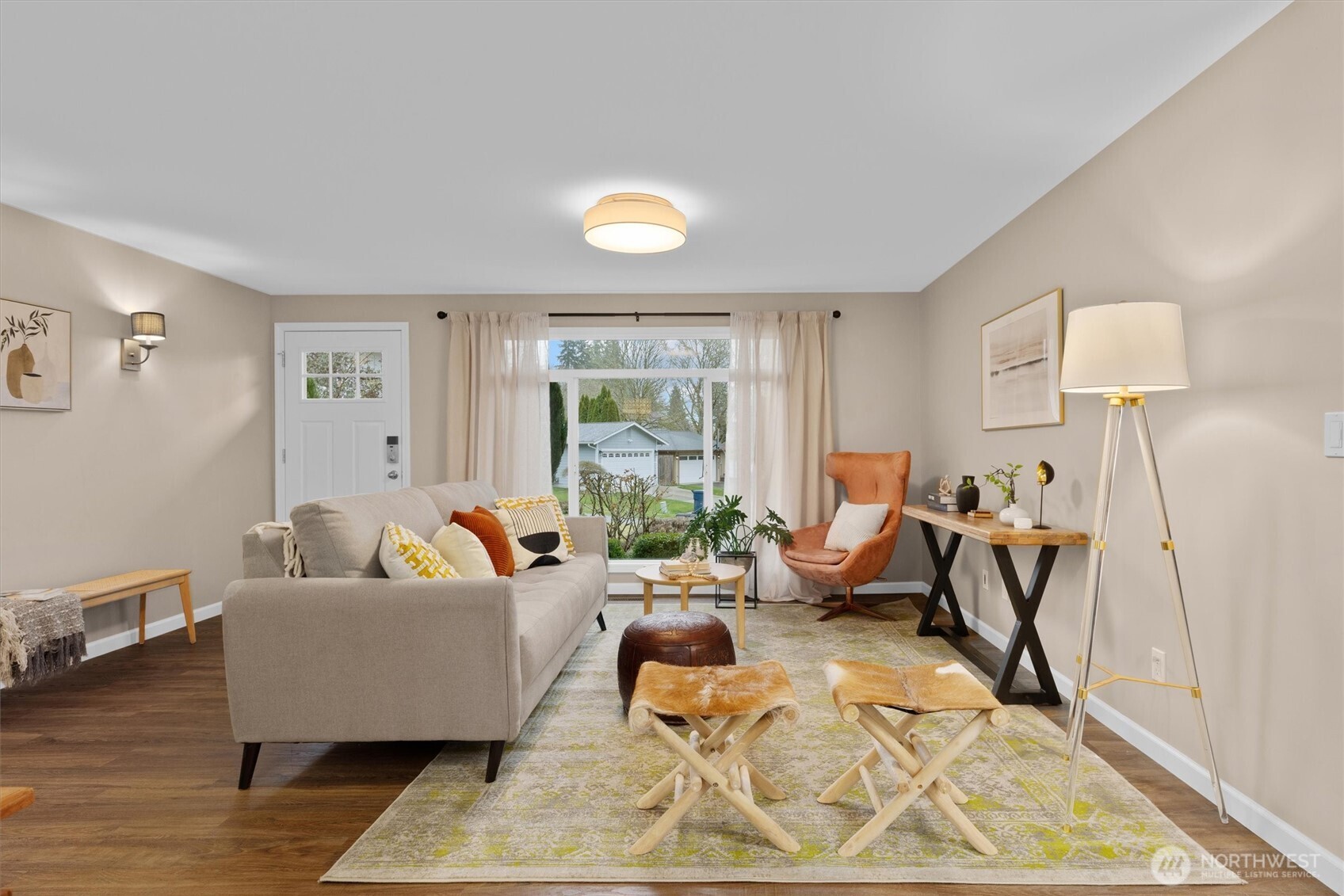 View from dining through living room to front yard.