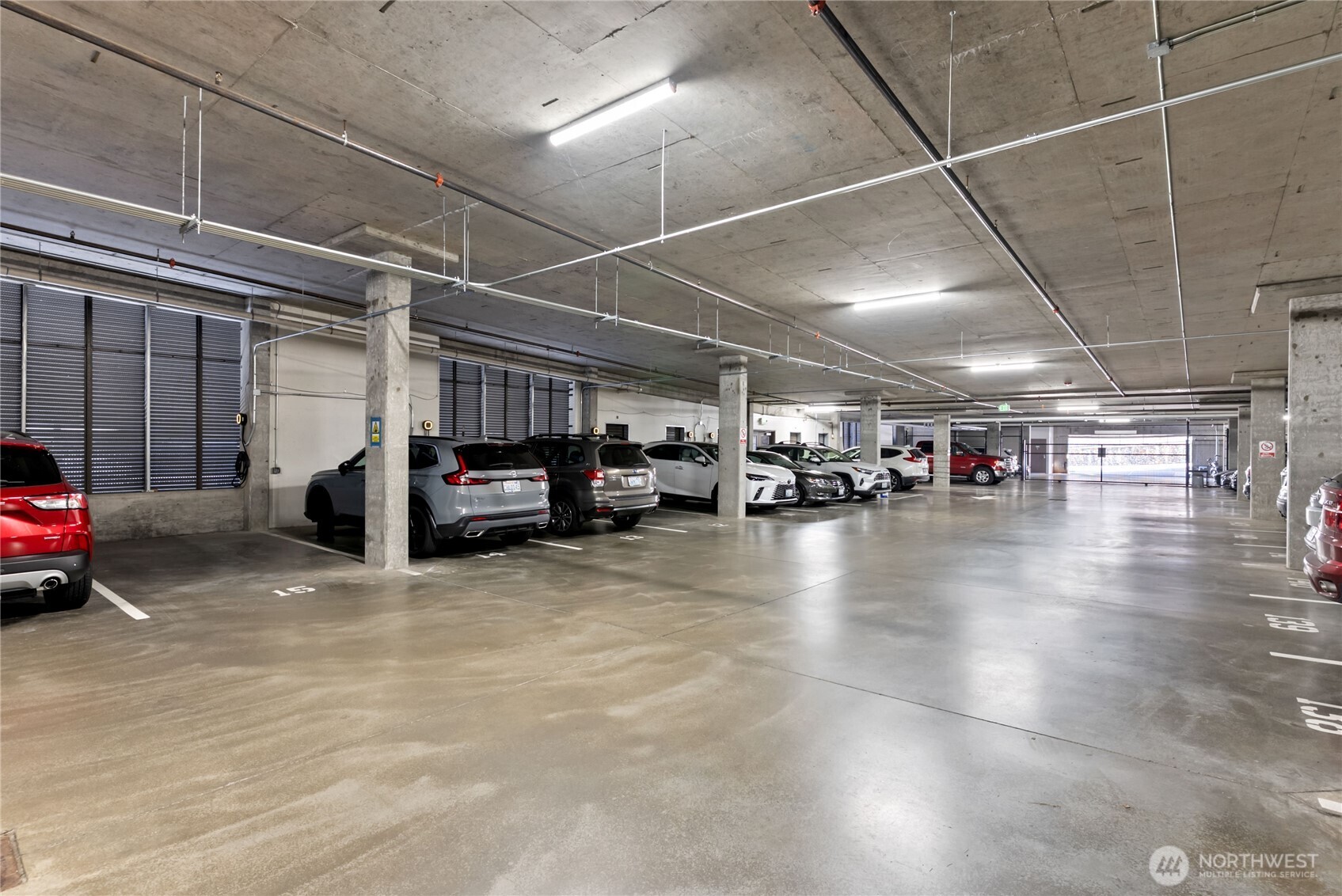Garage covered parking space with an EV charger.