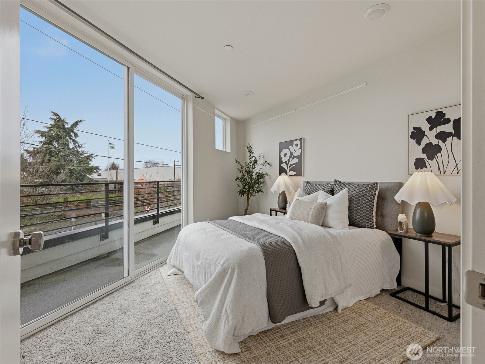 The primary bedroom's slider walks out to the deck - perfect for morning coffee