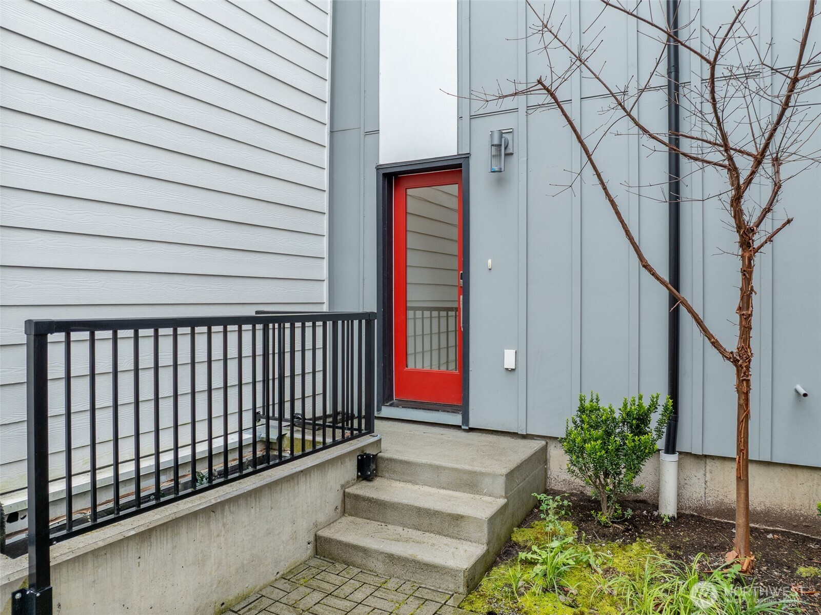 The main entrance off the community courtyard offers privacy to owners