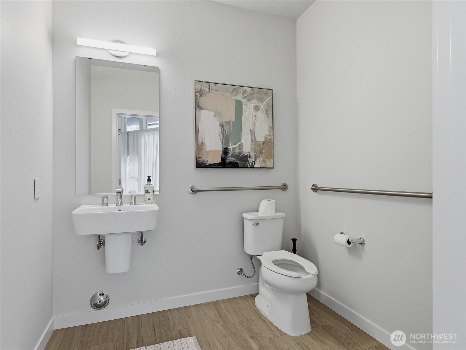 Spacious half-bath off the live/work space on the entry level