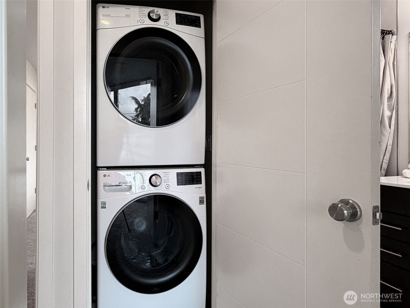 The full-size washer/dryer is conveniently located next to the primary bedroom