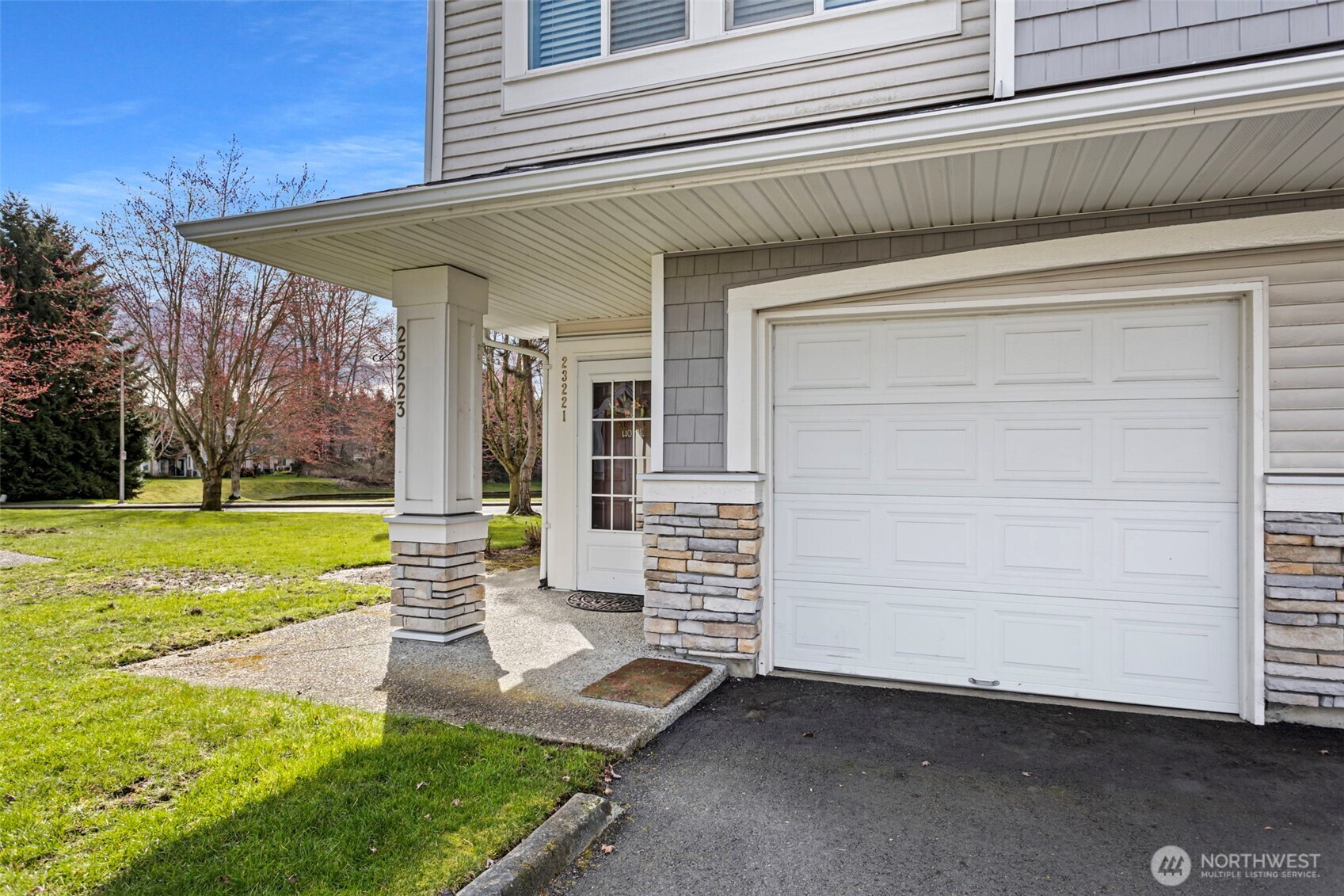 Attached garage with extra storage space.