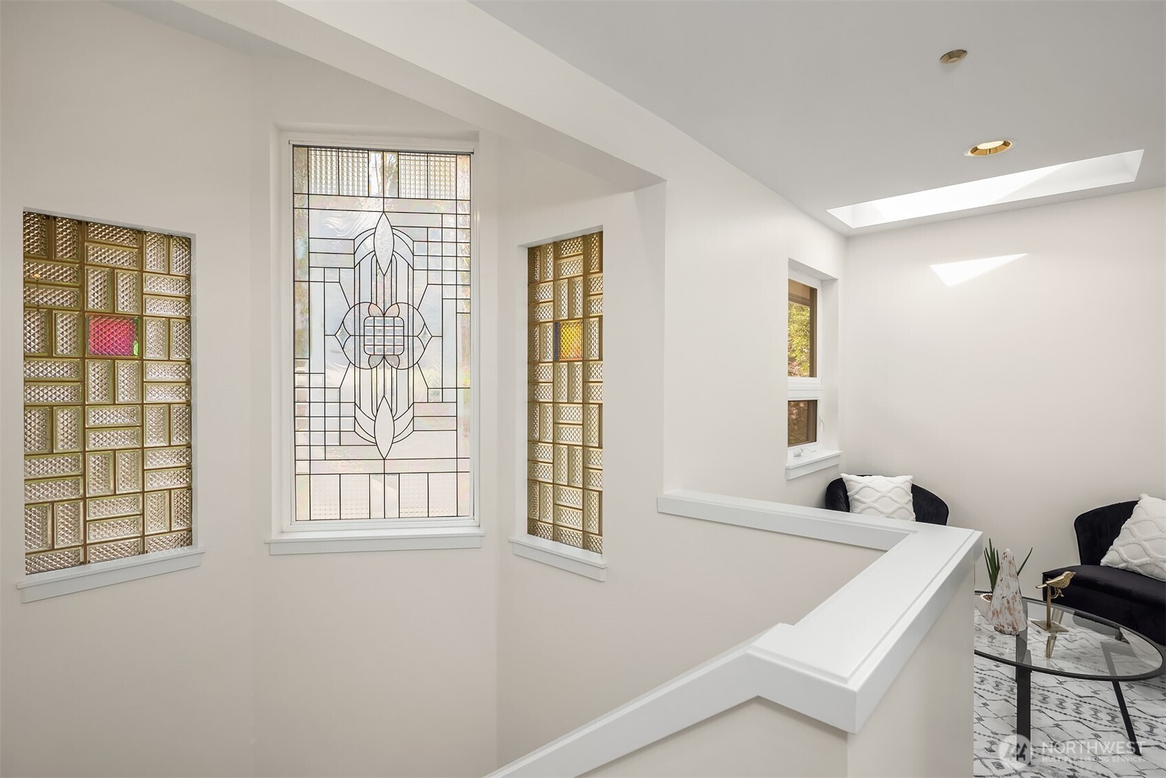 The architectural windows bring charm and character. There's a loft style sitting area upstairs